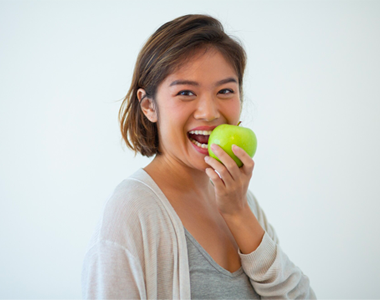 Women eating an an apple